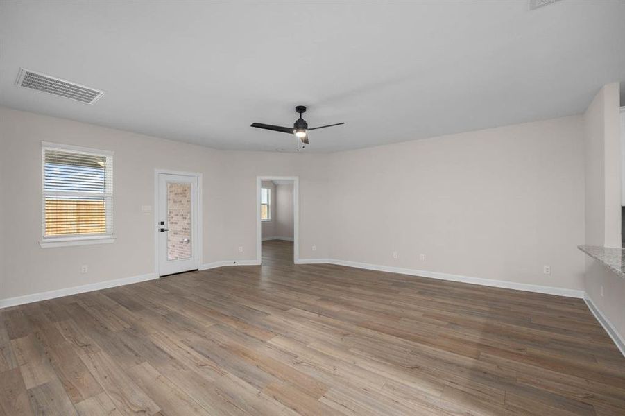 The living room is spacious and overlooks the back patio.