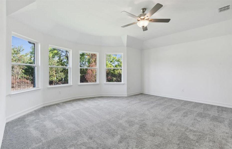 Elegant owner's suite with Bay Window *real home pictured