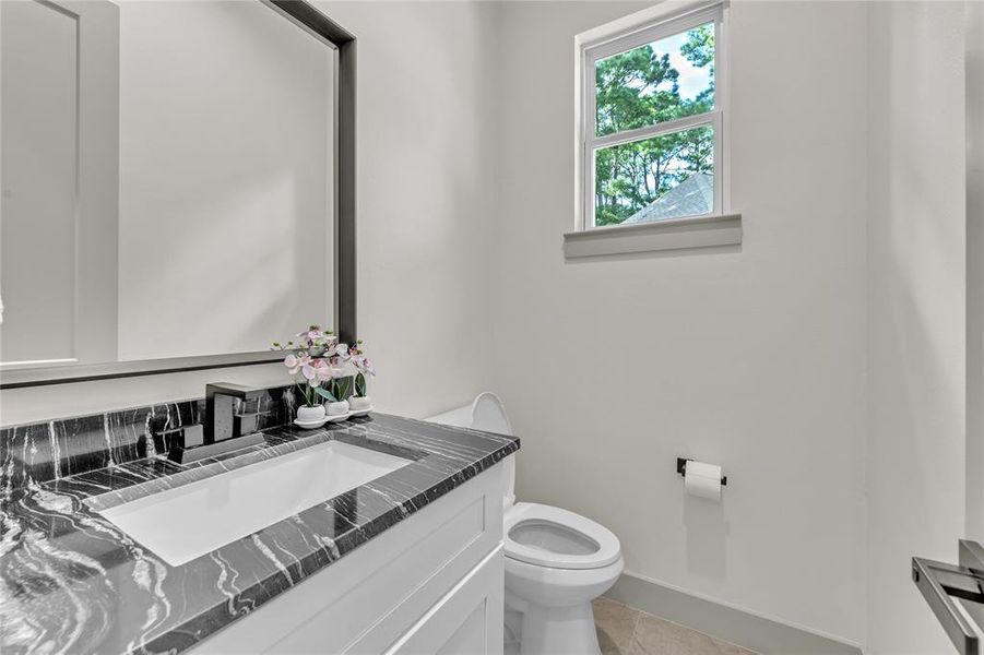 Half bath downstairs that has natural light coming in.