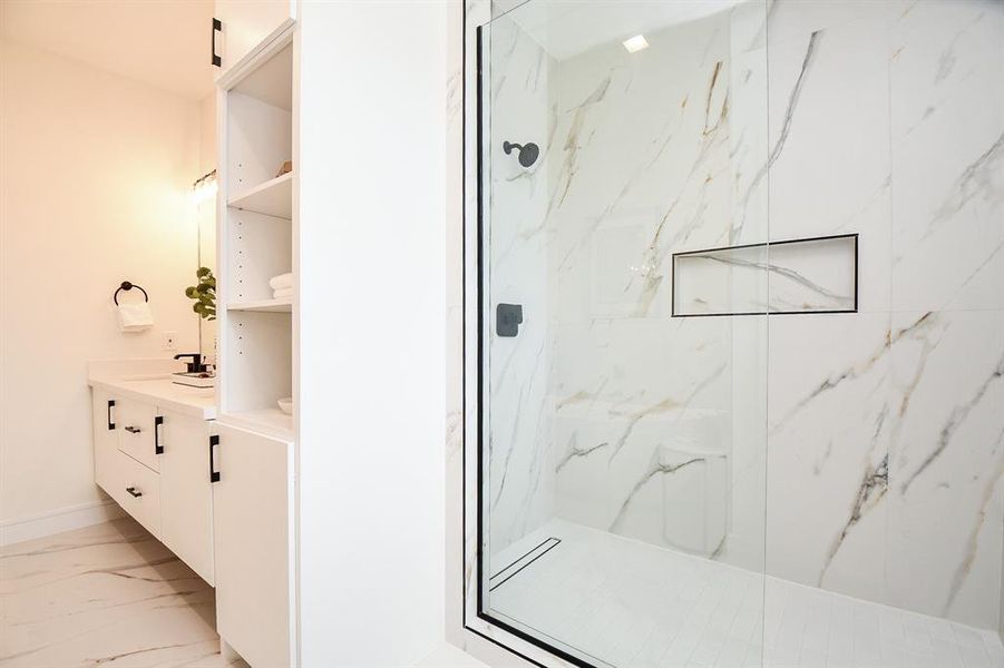 The oversized shower shows off more of the quality and detail that you will be hard pressed to find elsewhere. The slotted drain and large utlility nook actually add style to the shower