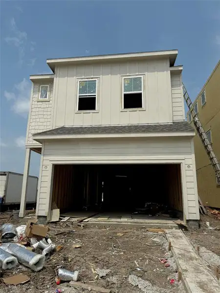 Three-story home with 3 bedrooms, 3.5 baths and 2 car garage on a corner lot