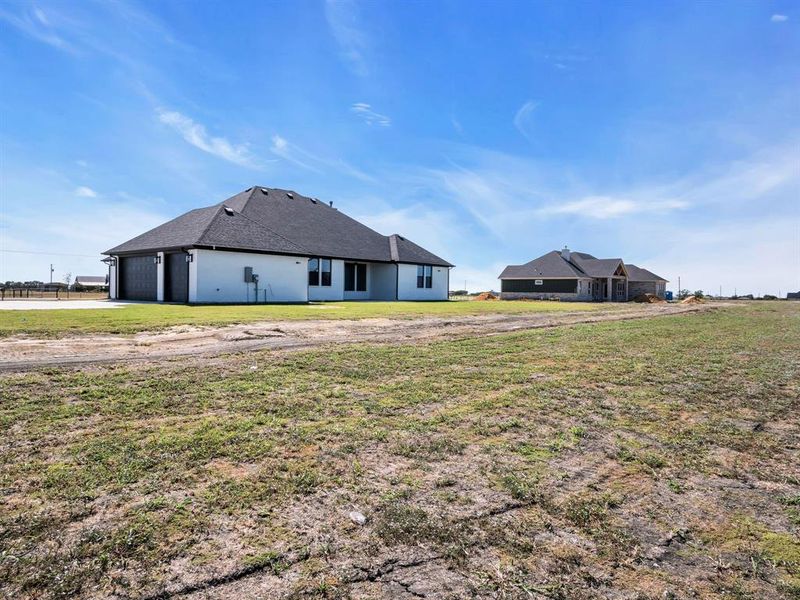 View of yard featuring a garage