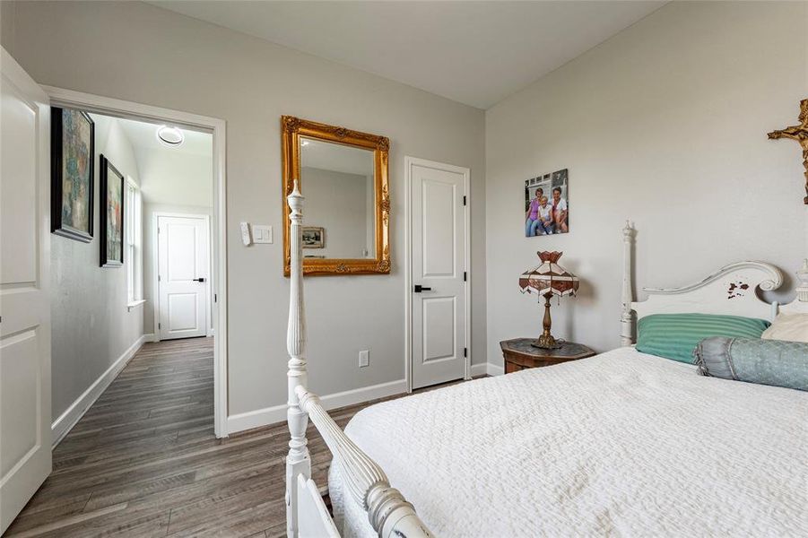 A charming secondary bedroom with generous closet space and large windows