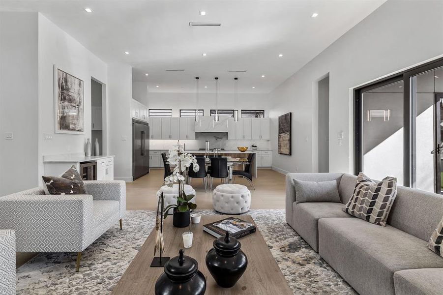 Living room featuring beverage cooler and light wood-type flooring