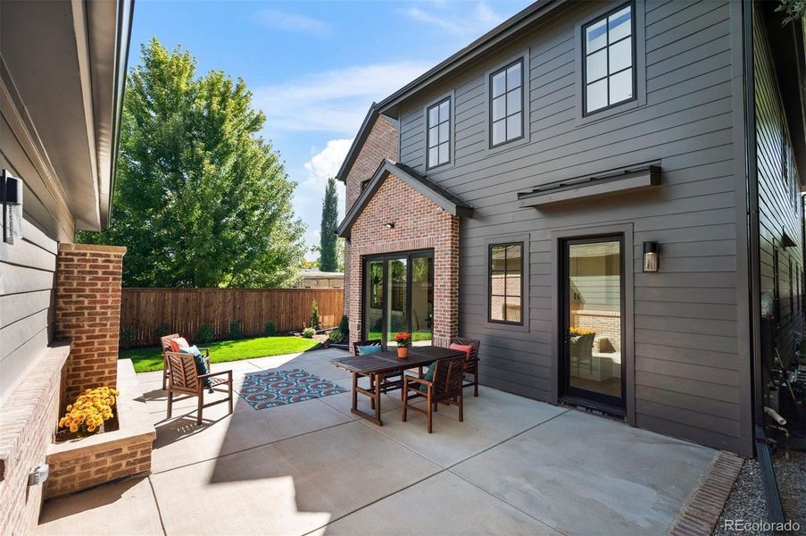 Back Patio with Fireplace and Heated path to Garage