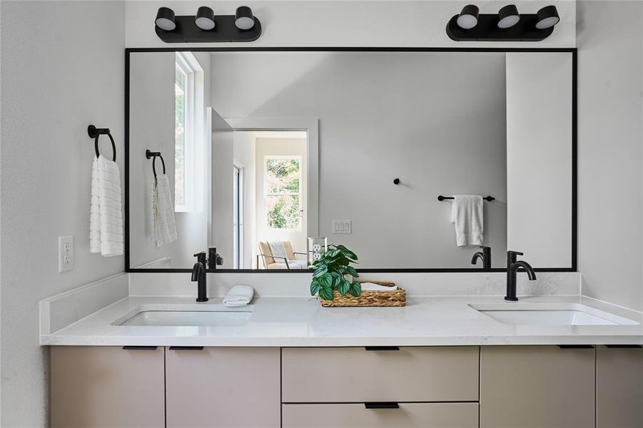 primary bathroom with dual vanities