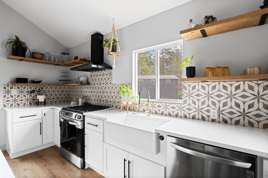 Modern appliances, hardware, faucet, sink, backsplash, and shelving