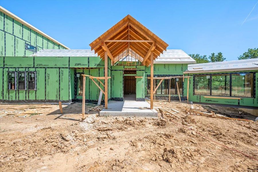 Grand Entrance of Estate home showcasing glass bridge leading to master bedroom