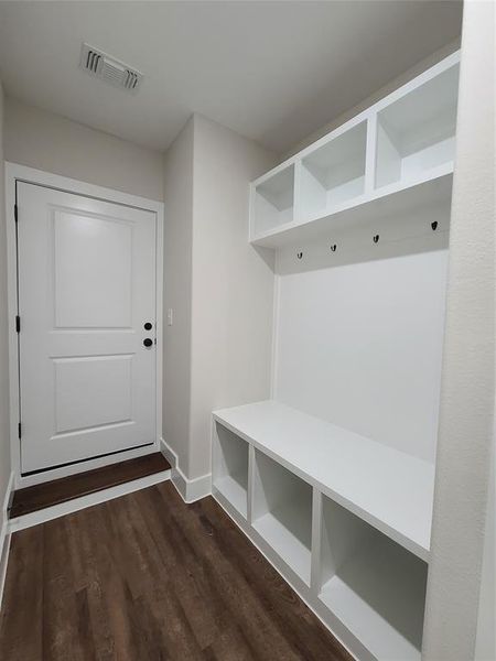 Mudroom with dark wood-type flooring