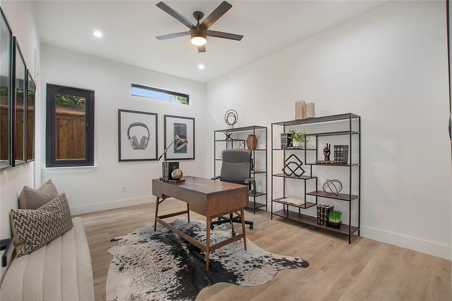 Office with ceiling fan and light wood-type flooring