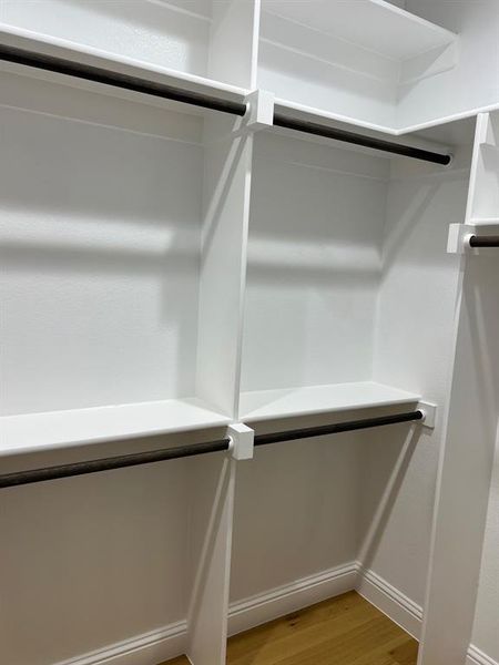 Walk in closet featuring light wood-type flooring