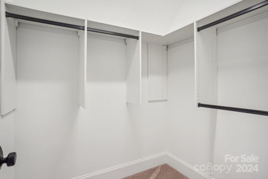 Custom Closet systems throughout.