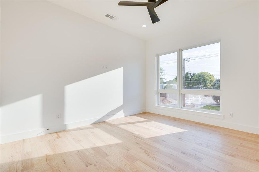 Spare room featuring light hardwood / wood-style floors and ceiling fan