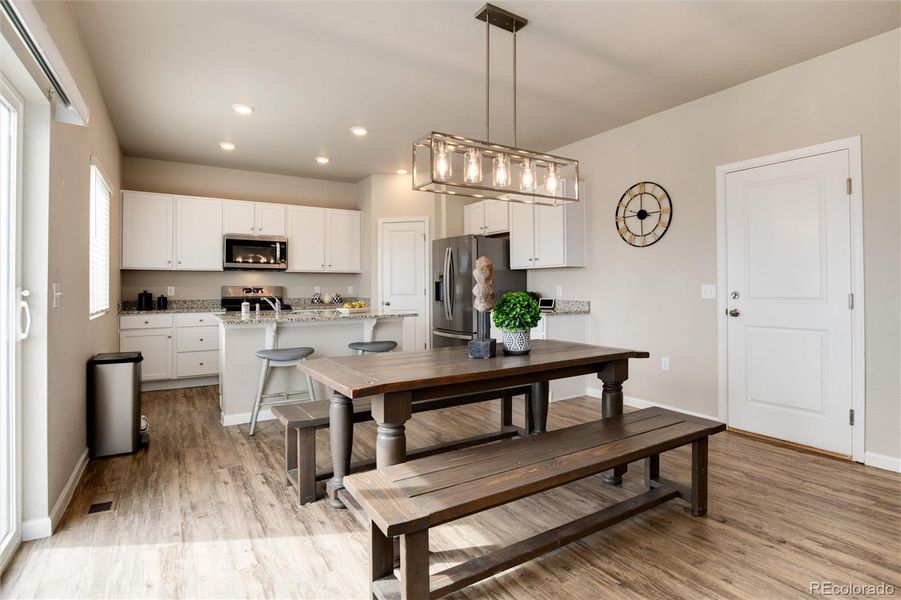 Dining space with updated light fixture.