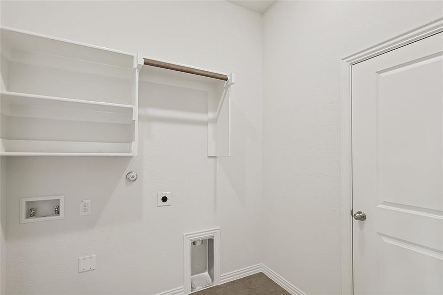 Washroom featuring hookup for a washing machine, hookup for an electric dryer, and gas dryer hookup