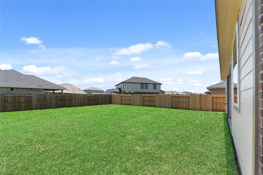 This backyard is perfect for family gatherings, social events, or simply unwinding in the fresh air.