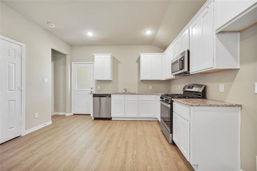 Nice kitchen with granite counters and stainless appliances