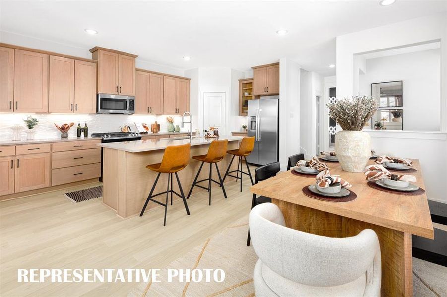 You'll find sophisticated kitchens paired with elegant dining spaces in our homes in Solterra!  REPRESENTATIVE PHOTO