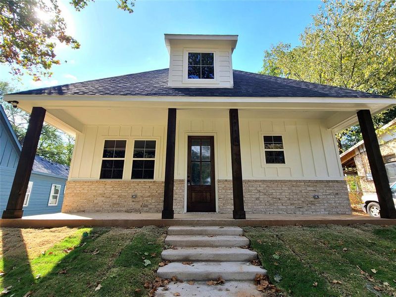 View of front of property featuring covered porch