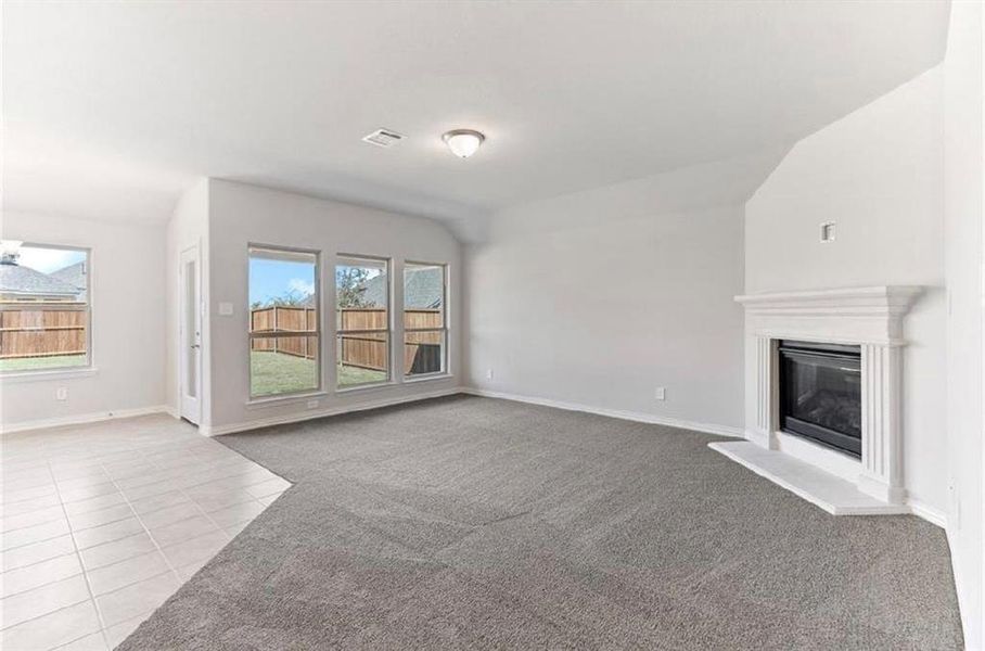 Great Room featuring Large Windows and Heatilator Fireplace