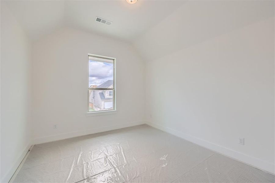 Bonus room with a wealth of natural light and lofted ceiling