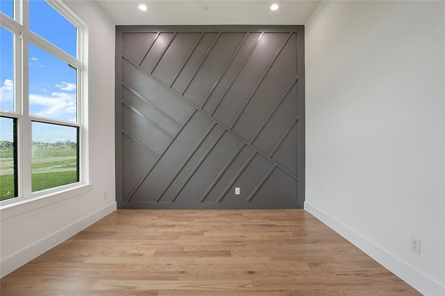 Spare room featuring light wood-type flooring