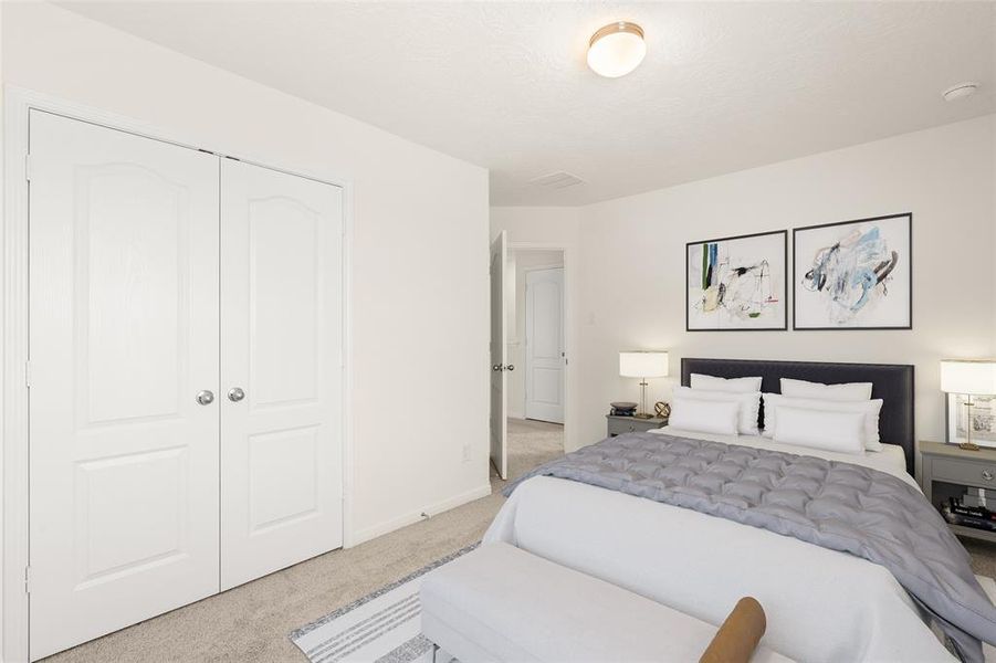 Secondary bedroom features plush carpet, custom paint and a large window with privacy blinds.