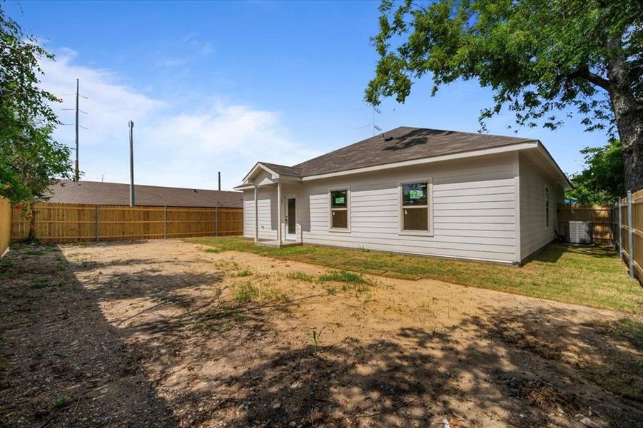 Back of property with cooling unit