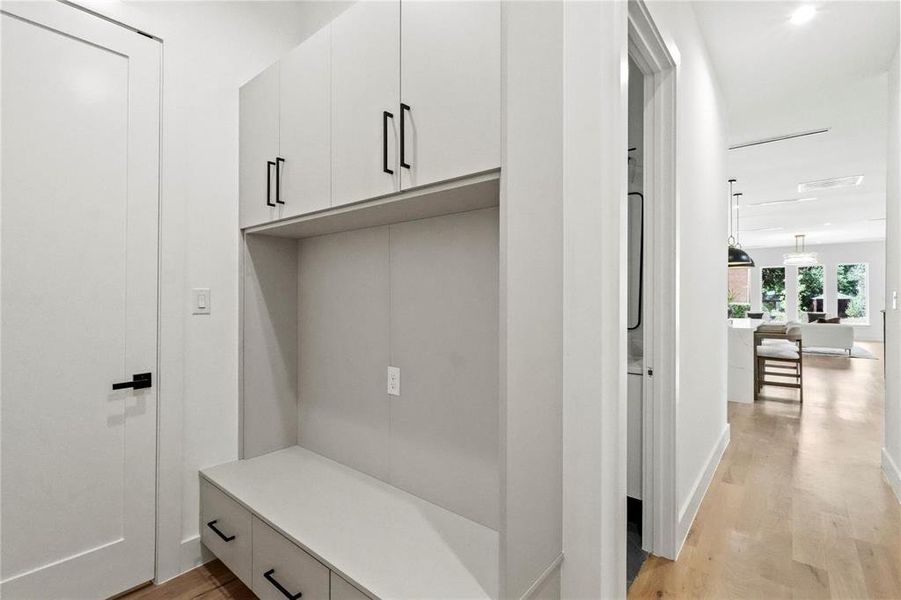 Mudroom with light hardwood / wood-style floors