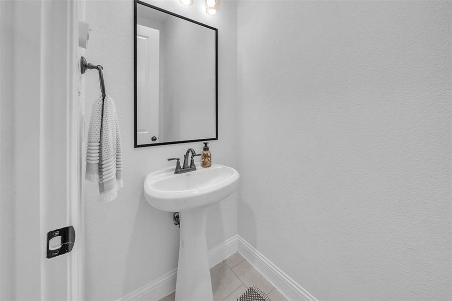 Bathroom with tile patterned floors