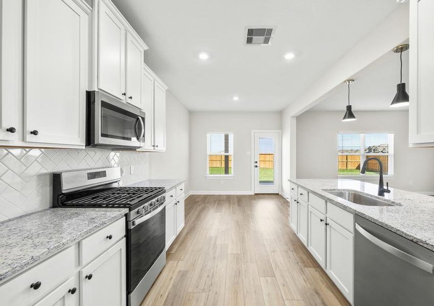 Stainless steel appliances come with the kitchen.