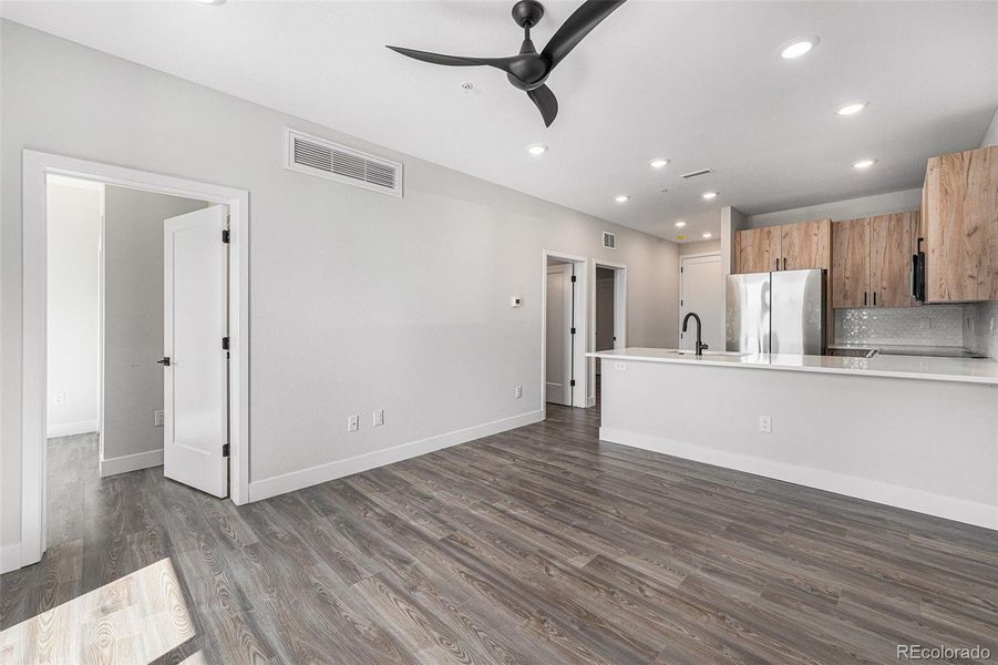 From living to typical kitchen area.  Primary bedroom entrance to the left.