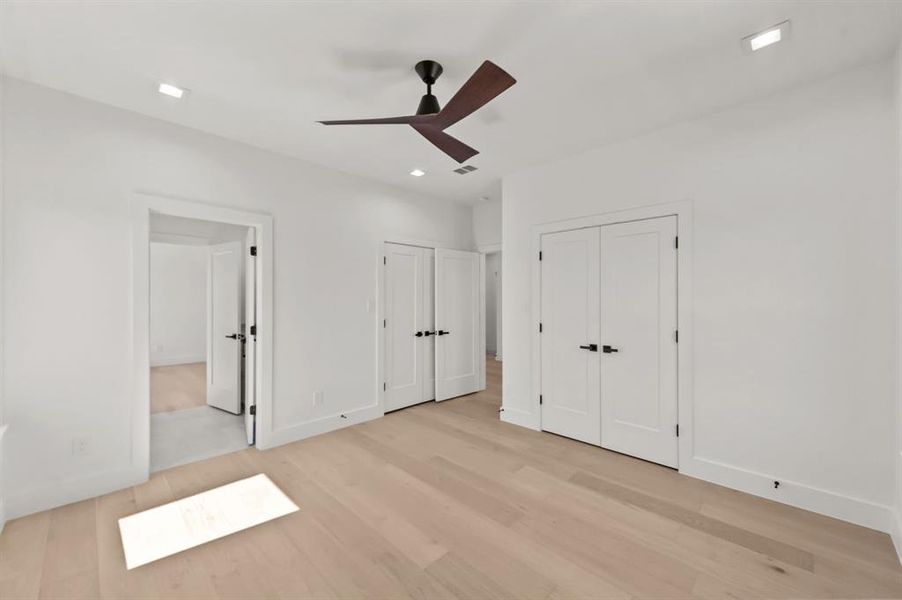 Fourth bedroom on 2nd Floor with light hardwood / wood-style flooring and ceiling fan