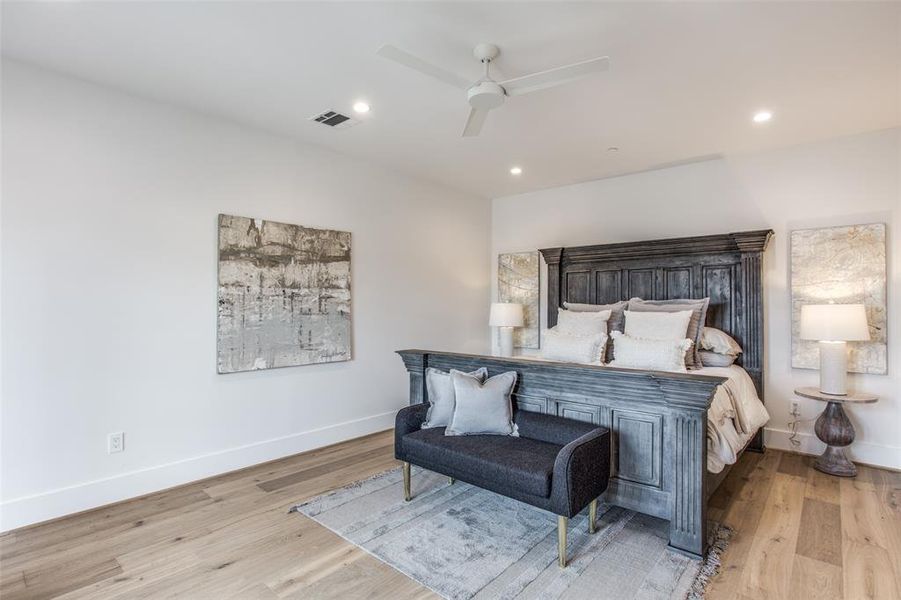 Bedroom featuring light wood flooring and ceiling fan