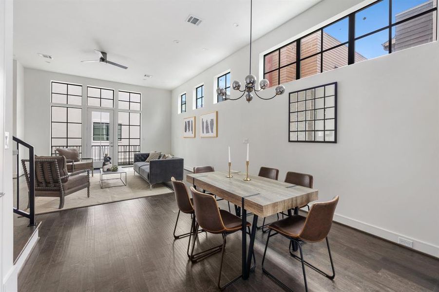 Thanks to the clever floor plan, this open dining room seamlessly connects with the surrounding spaces, offering a welcoming atmosphere for gatherings and shared meals.