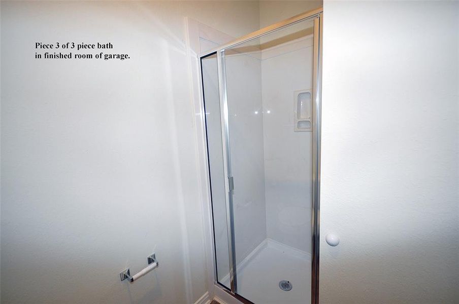 The 3rd piece is this shower including a glass door and cultured marble surround.