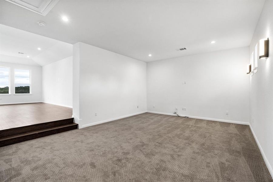 Spacious flex space upstairs would make the perfect movie or game room