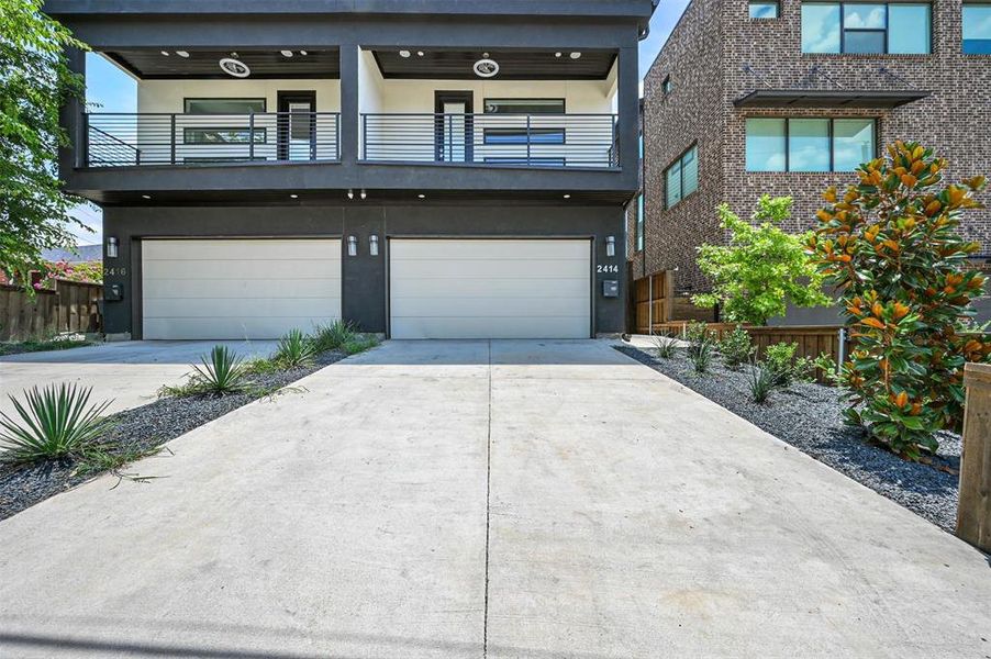 Contemporary home with a garage and a balcony