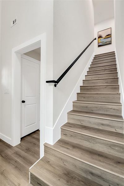 Staircase with wood-type flooring