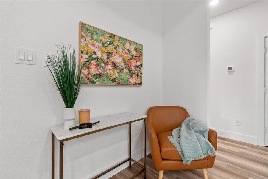 Sitting room with hardwood / wood-style floors