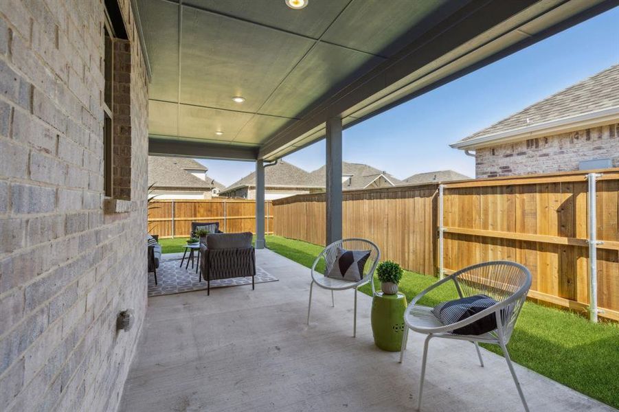 View of patio with an outdoor hangout area