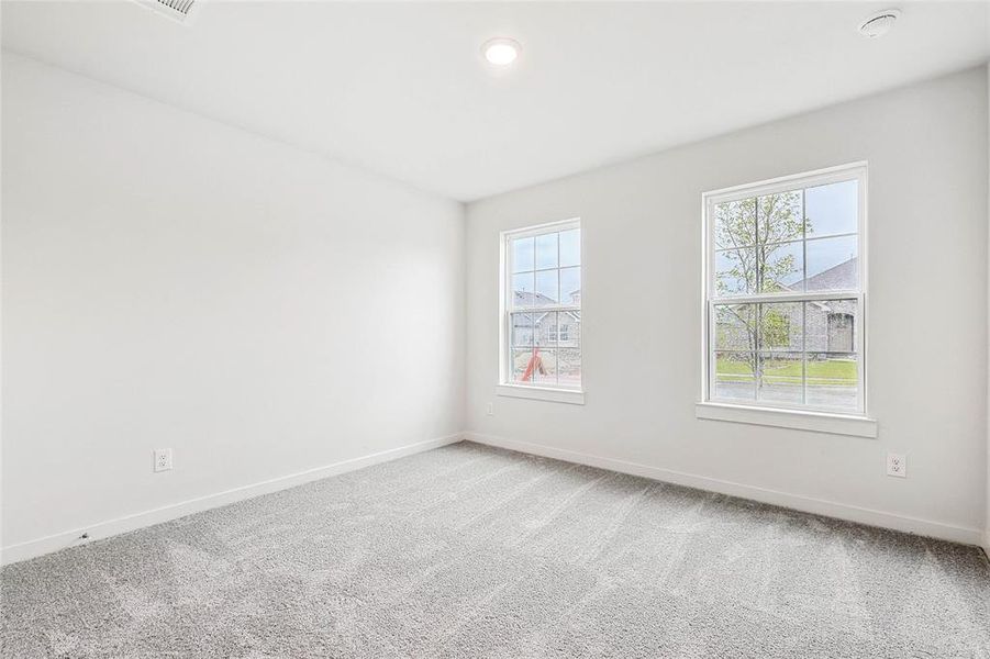 Unfurnished room with carpet