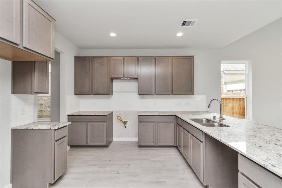 This generously spacious kitchen is a dream realized!