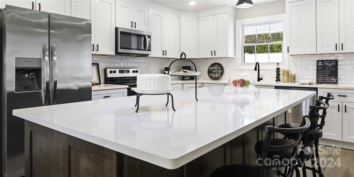 Lots of counter space & cabinets & prep areas.