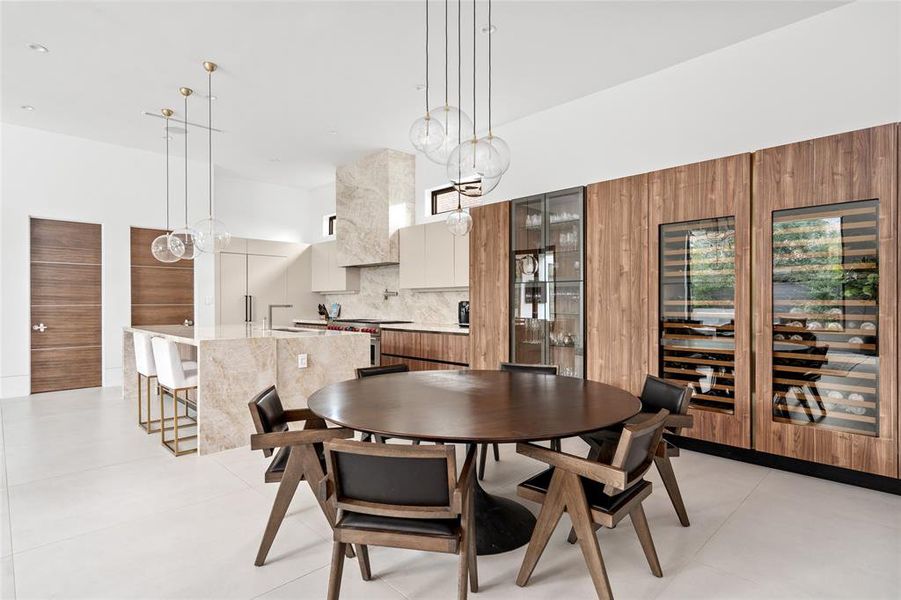 This beautifully designed space offers a seamless flow from the kitchen to the dining area, perfect for meals with friends and family. The meticulously designed open layout allows for effortless movement between the two areas, perfect for entertaining.