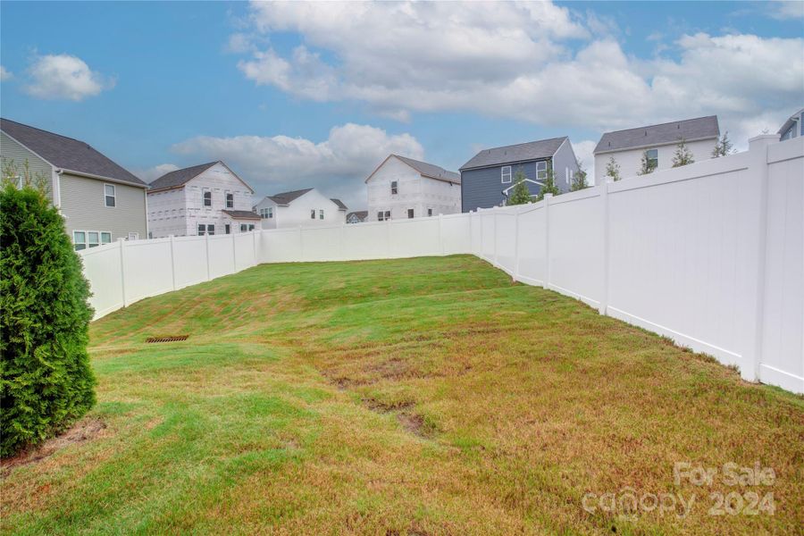 The back lawn is completely fenced for privacy.