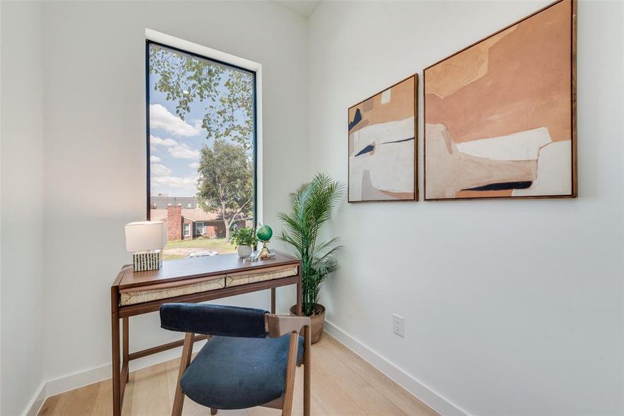 Office space featuring light wood-type flooring