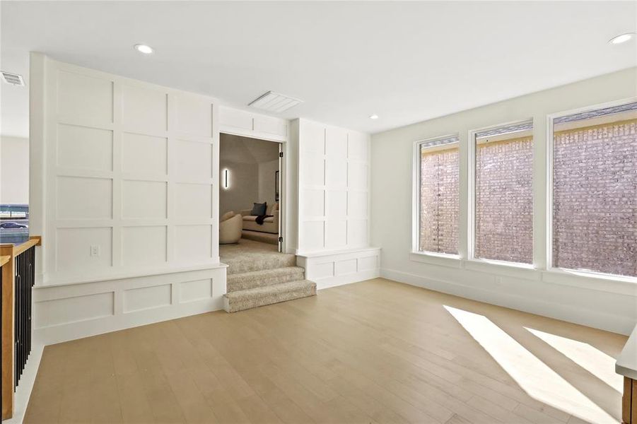 Unfurnished living room featuring light wood-type flooring