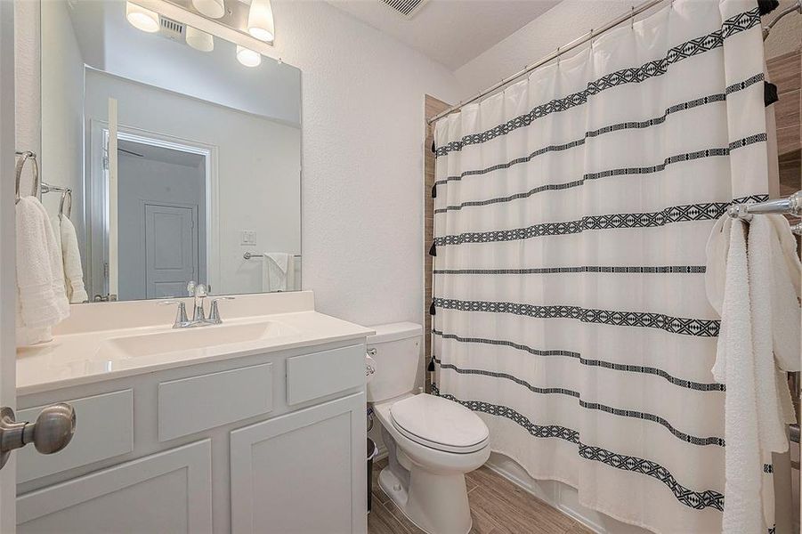 This bathroom's simple design with minimal fixtures makes it easy to clean and maintain.