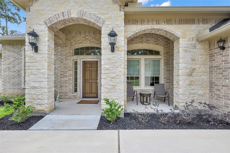 Covered front porch with perfect sitting space to relax